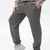 Pantaloni gri cu elastic jos, țesătură rezistentă din poliester și elastan, ideal pentru activități sportive. Sportivi pentru bărbați