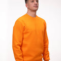 Hanorac clasic oranj, model modern și vibrant, ideal pentru un look casual.
